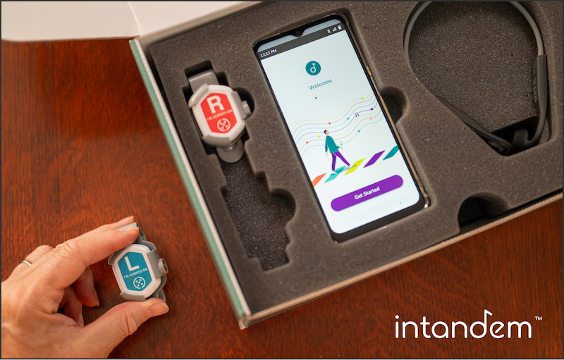 Order InTandem, with box and hand holding the left shoe-worn sensor; walking after a stroke