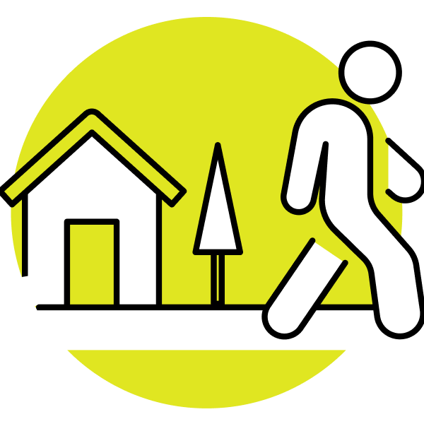 Pedestrian walking along a sidewalk beside a house and tree inside a yellow circular sign.
